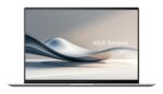 Nešiojamas kompiuteris ASUS ZenBook UX5406SA, matomas iš šono, su atidarytu ekranu